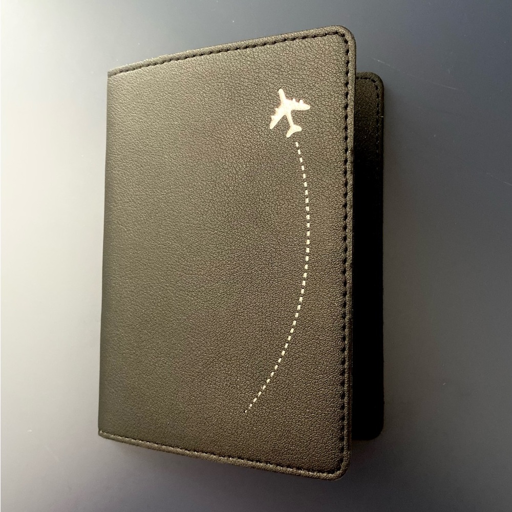 Black Passport Holder with Silver Airplane Design